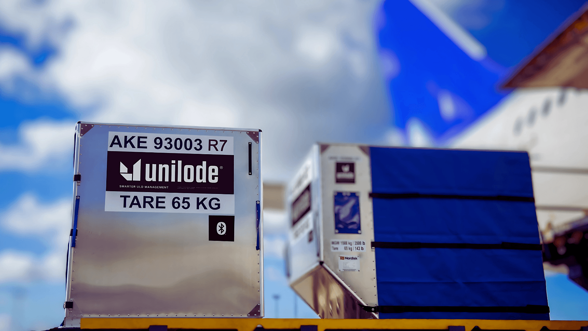 Unilode ULD containers staged on an airport apron