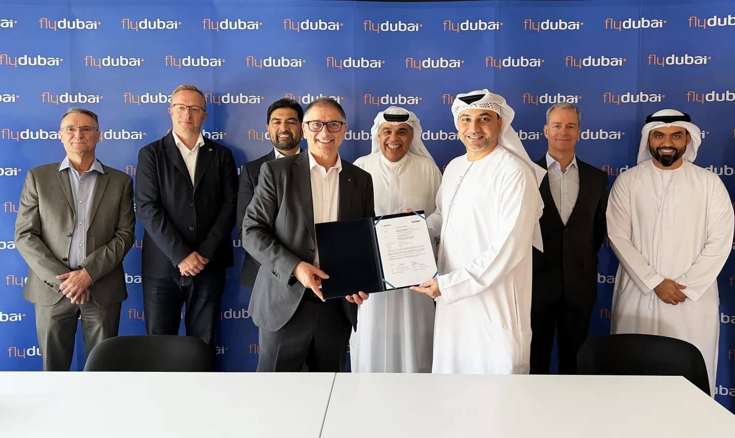 flydubai and Unilode executives signing their partnership agreement