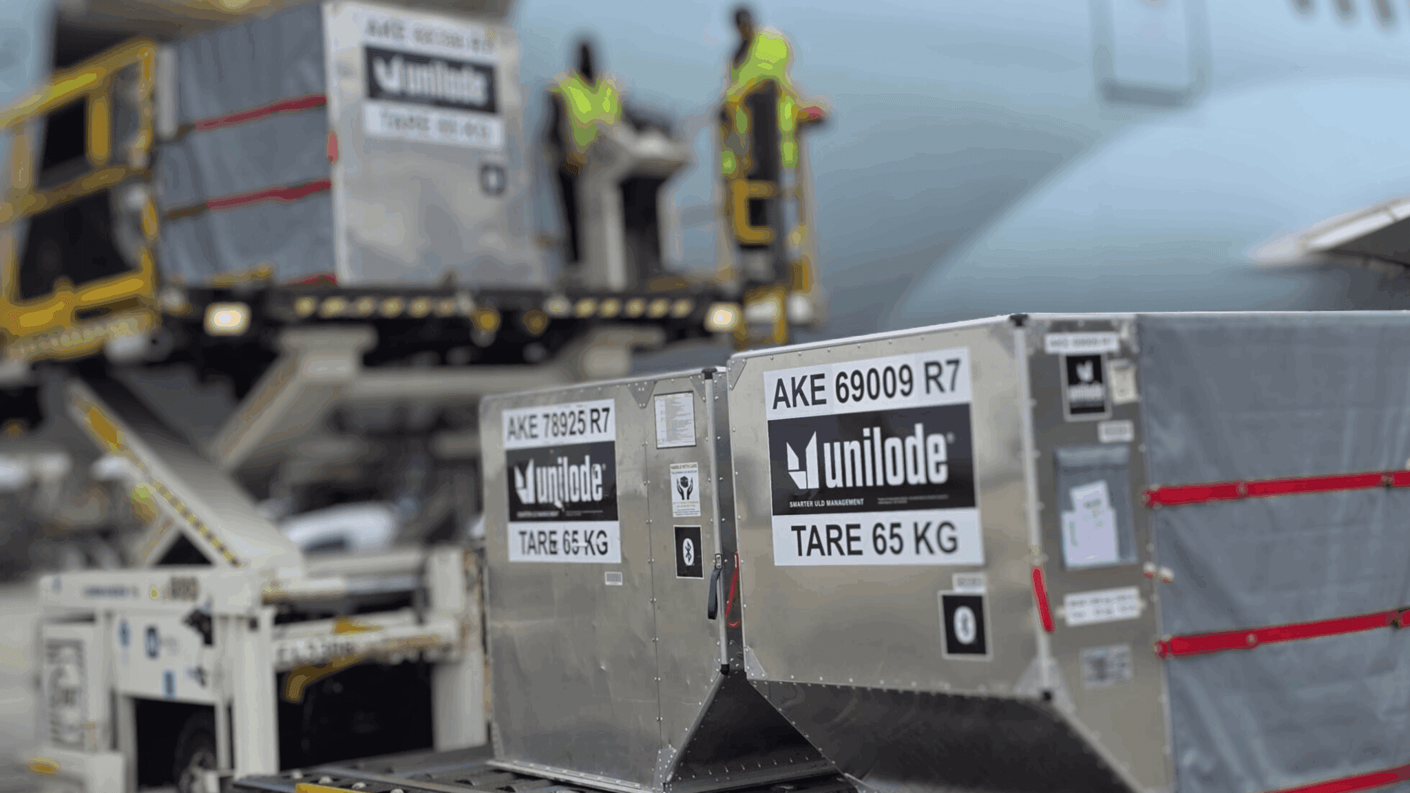 Unilode ULD containers staged beside an aircraft